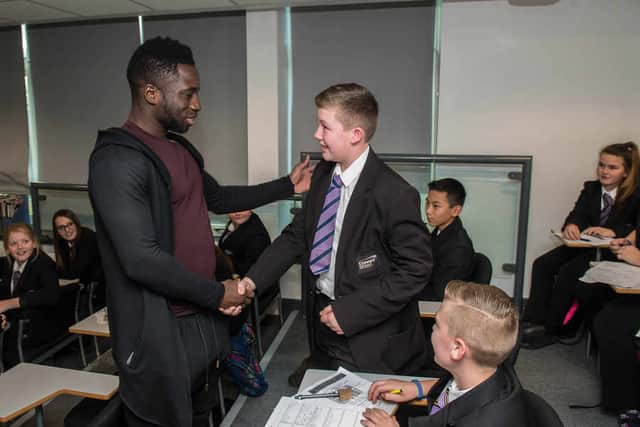 Wolves players Nouha Dicko and Ibrahim Keita paid a visit to Coppice Performing Arts School, Wednesfield, on Monday. Regan Tomlinson, 12, was given a present and the chance to be a mascot at the Blackburn Rovers V Wolves fixture.