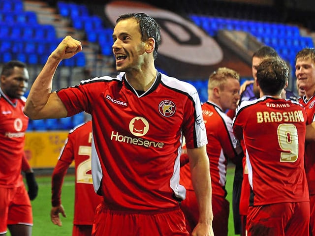 Ben Purkiss of Walsall celebrates after the victory at Tranmere in the Northern area semi-finals.