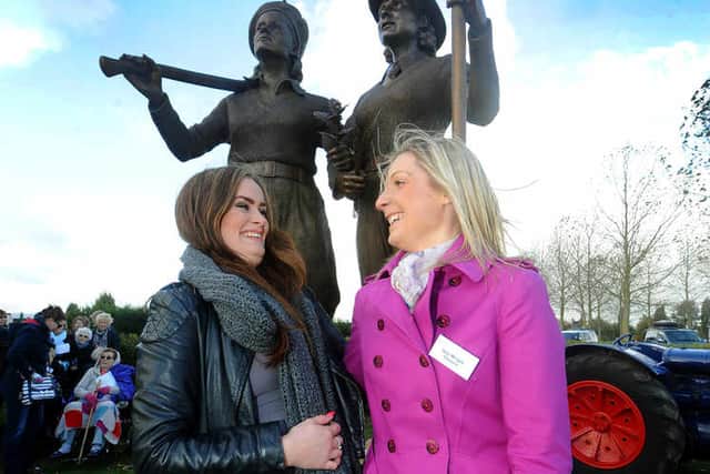 Sarah Martin and Izzy Wright from Stafford, who posed for the statue.