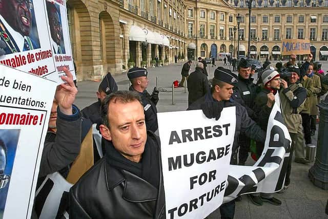 Tatchell demonstrating against Mugabe