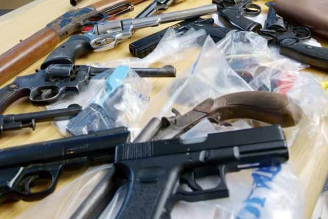 Andy Bannister with some of the weapons seized
