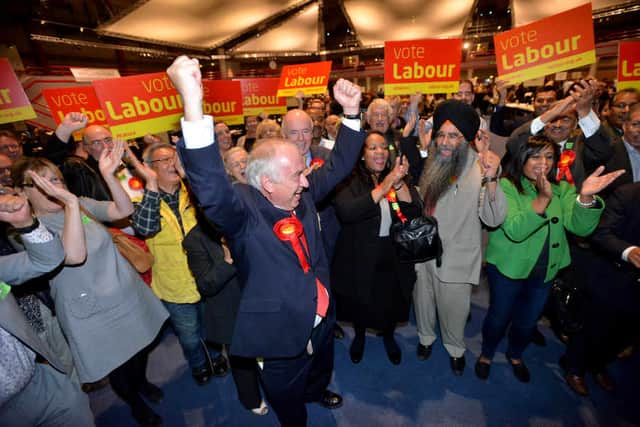 David Jamieson celebrates with Labour activists.