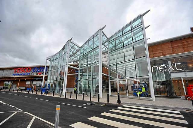 Exterior of New Square showing its Next and Tesco stores.