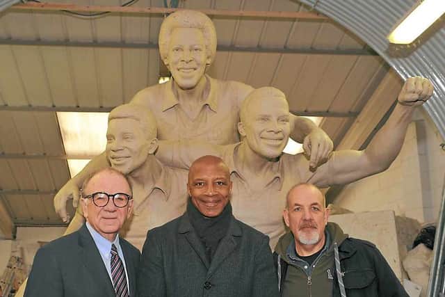 Businessman Jim Cadman, Albion star Cyrille Regis and sculptor Graham Ibbeson with the clay version