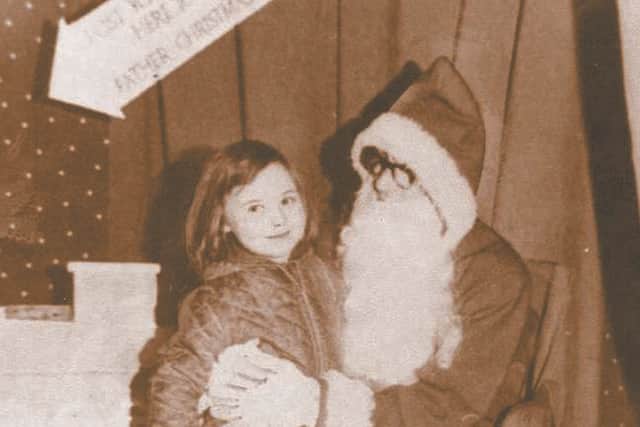 Christine Darby with Santa Claus in 1966