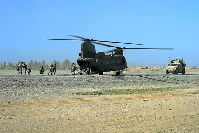 The walking wounded are helped into the helicopter after the explosion