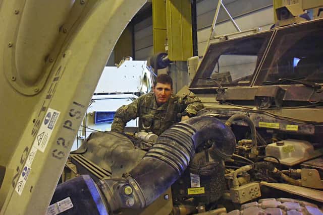 Hard work – Sgt Matthew Price works on one of the vehicles, making sure it adheres to UK roadworthy standards