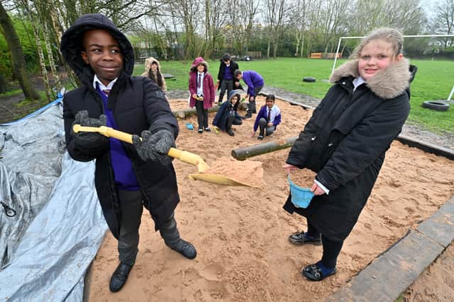 The school has been given an OPAL Award (Outdoor Play and Learn) and they have many interesting things for children to do at break including this huge sand pit, used by Ade and Olivia