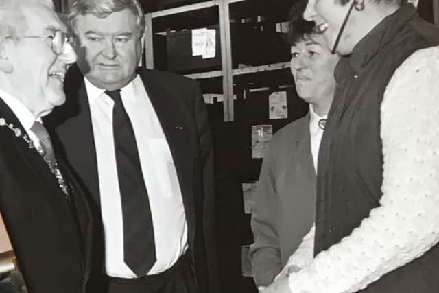 Robert Lench (centre) with the mayor. 