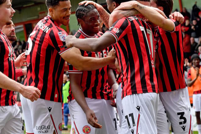 Walsall celebrate Aaron Loupalo-Bi’s opener against Gillingham on Friday.