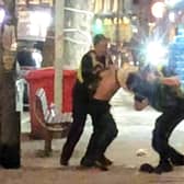 The dramatic moment police body-slammed a man after he grappled with them while they tried to arrest him. 