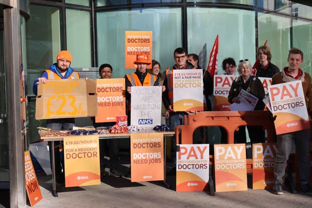 Resident doctors begin their strike outside Queen Elizabeth Hospital in Birmingham. 
