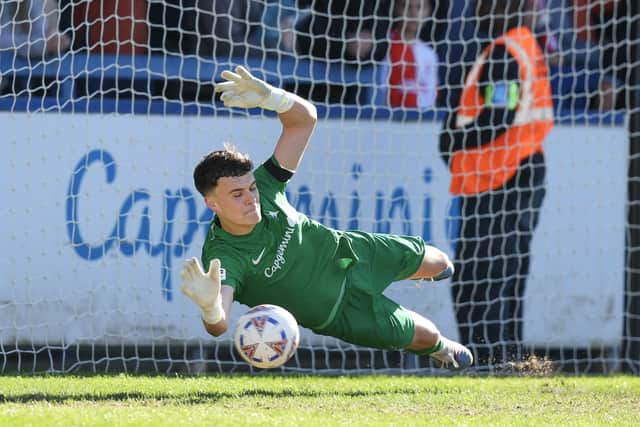 Josh Gracey of AFC Telford United saves a penalty from Amari Morgan-Smith of Kidderminster Harriers