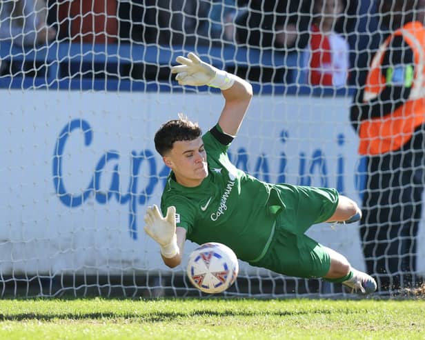 Josh Gracey of AFC Telford United saves a penalty from Amari Morgan-Smith of Kidderminster Harriers
