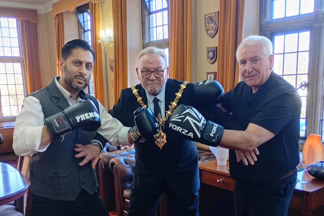 Mayor of Dudley, Councillor Pete Lee, tries to keep Shaz Salem and council leader Patrick Harley apart as they prepare for their big showdown