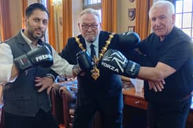 Mayor of Dudley, Councillor Pete Lee, tries to keep Shaz Salem and council leader Patrick Harley apart as they prepare for their big showdown
