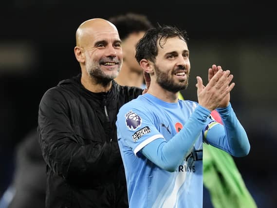 Bernardo Silva (right) with Manchester City manager Pep Guardiola