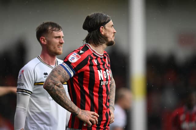 A deflated Aden Flint looks on for Walsall.
