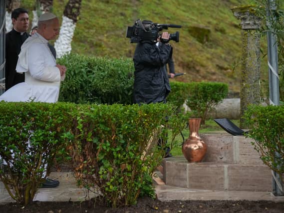 Pope Leo prays as he visits the archaeological site of Hippo, in Annaba, Algeria