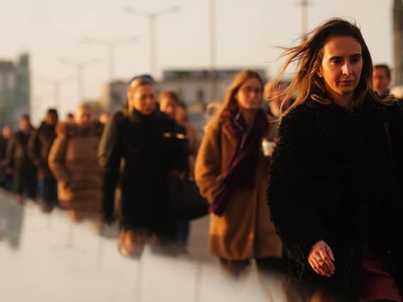 People walking on the way to work in London