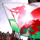 A Welsh flag with the sun in the background