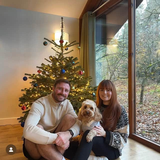 Darren Whitley and Jess Roberts taken in 2023 with their pet Cavapoo, Calvin, during Miss Roberts' final Christmas at home.