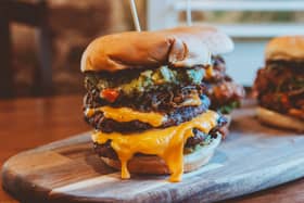 The stacked burgers will be among the menu items available for less during the week at the Red Lion