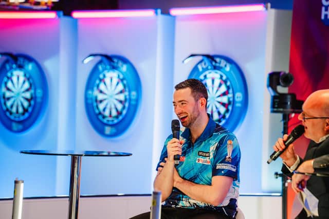 Renowned darts commentator Paul Starr interviewing Luke Humphries during the Grand Final