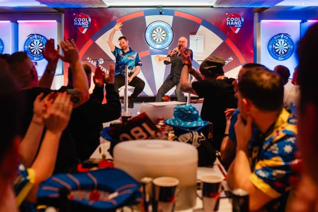 Renowned darts commentator Paul Starr interviewing Luke Humphries during the Grand Final