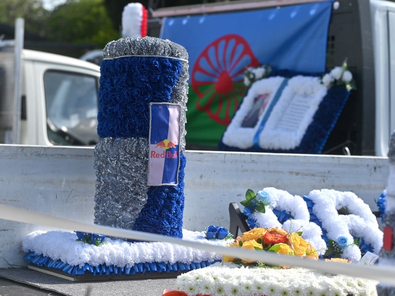  Pictured are funeral flowers outside his home, and traditional Romany Travelling homes he made    