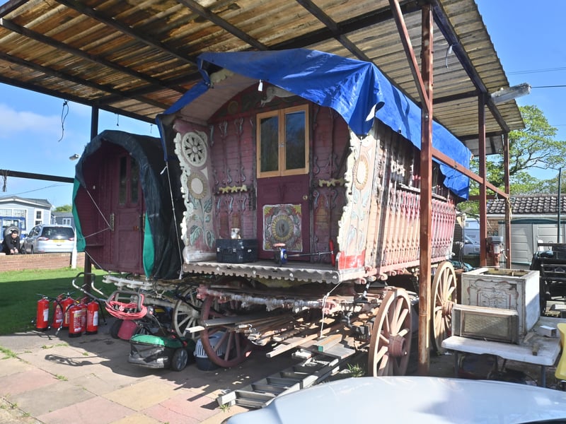  Pictured are funeral flowers outside his home, and traditional Romany Travelling homes he made.