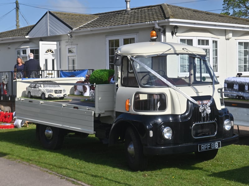  Pictured are funeral flowers outside his home, and traditional Romany Travelling homes he made