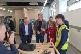 Mayor Richard Parker, Business Secretary Peter Kyle, and Sandwell College principal Lisa Capper chat with construction students at the new Cradley Heath skills centre