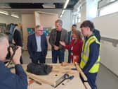 Mayor Richard Parker, Business Secretary Peter Kyle, and Sandwell College principal Lisa Capper chat with construction students at the new Cradley Heath skills centre