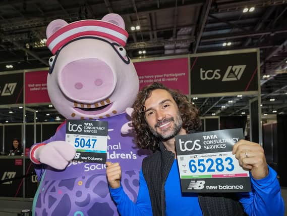Joe Wicks and Daddy Pig collect their running bibs at the TCS London Marathon Running Show at Excel London