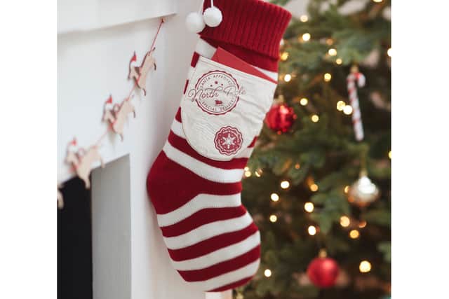 8. Red and White Knitted Christmas Stocking with Pocket, £9.99, Ginger Ray