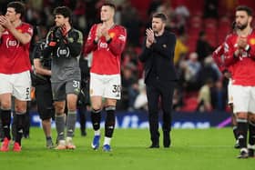 Manchester United manager Michael Carrick and players applaud