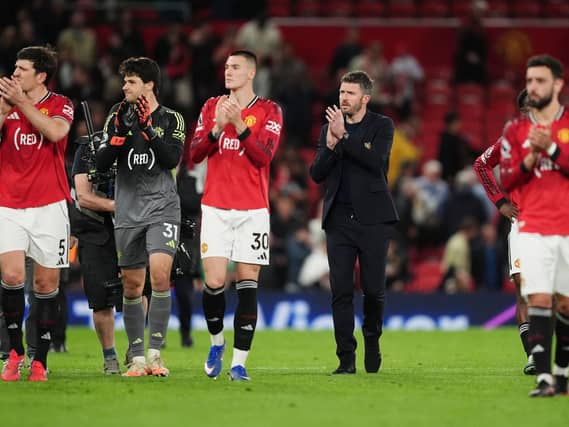 Manchester United manager Michael Carrick and players applaud