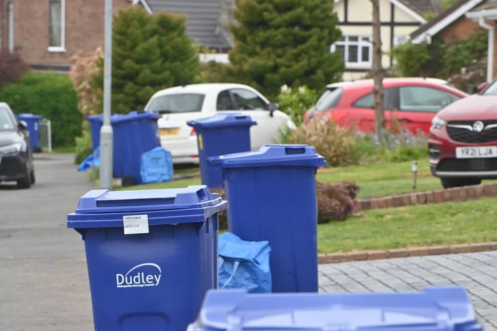 Blue recycling bins waiting to be emptied in Lyndale Road, Sedgley, a day late
