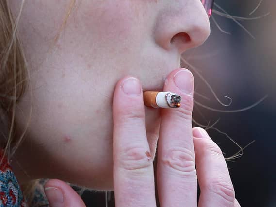 A young woman smoking
