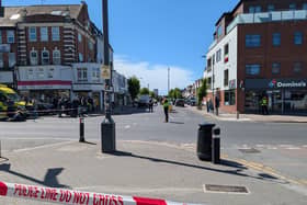 Police tape at at cordon on a street