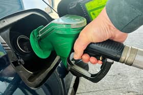 A person fills a car with petrol at a service station on the Dublin’s northside.