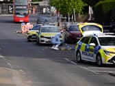 A forensics officer at the scene in Golders Green
