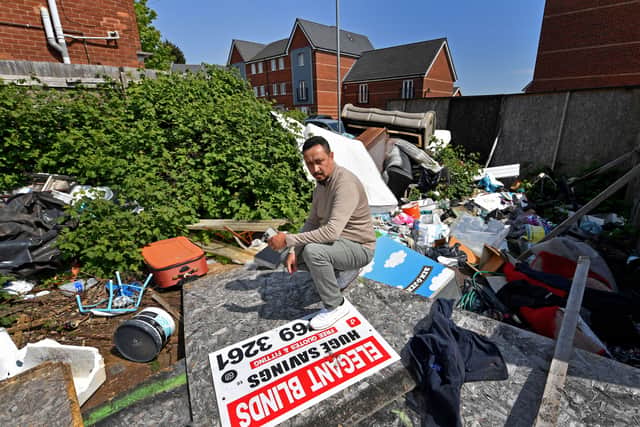Akbor Ali, who owns a house in Caledon Street, Walsall, is angry that fly-tipped rubbish hasn't been cleared for years.