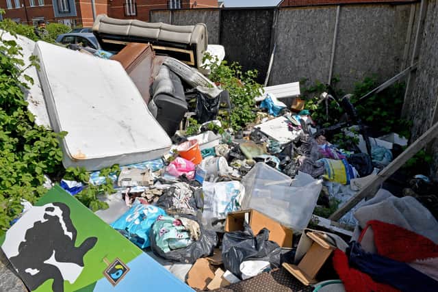 Mattresses, settees among the waste left near homes in Pleck. 