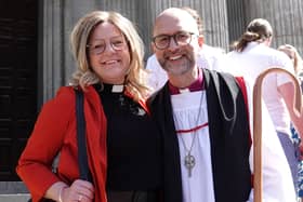The new Bishop of St Germans in the Diocese of Truro James Treasure poses with his wife Esther after the ceremony