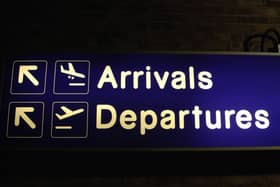 A sign for arrivals and departures