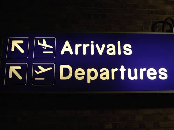 A sign for arrivals and departures