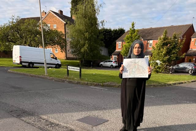 Cllr Shaneila Mughal with the pothole map for her ward. Picture Dudley Labour Party