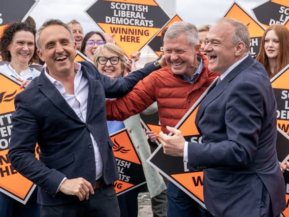 Scottish Liberal Democrat leader Alex Cole-Hamilton (left) with former leader Willie Rennie (centre) and Liberal Democrat leader Ed Davey (right) alongside newly-elected MSPs at Newhaven Lighthouse